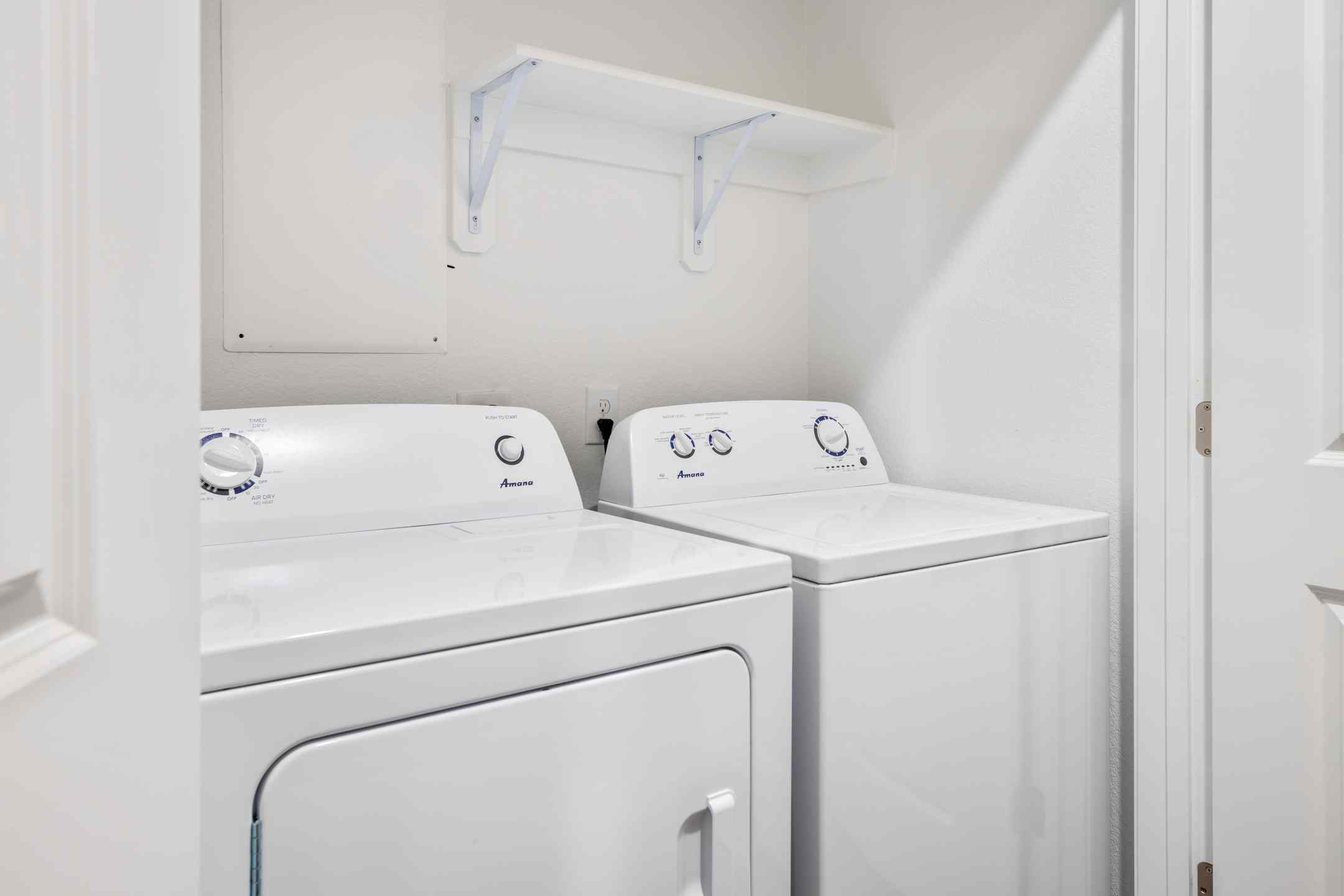 Apartment for student housing is fully equipped with a washer and dryer in a dedicated closet.