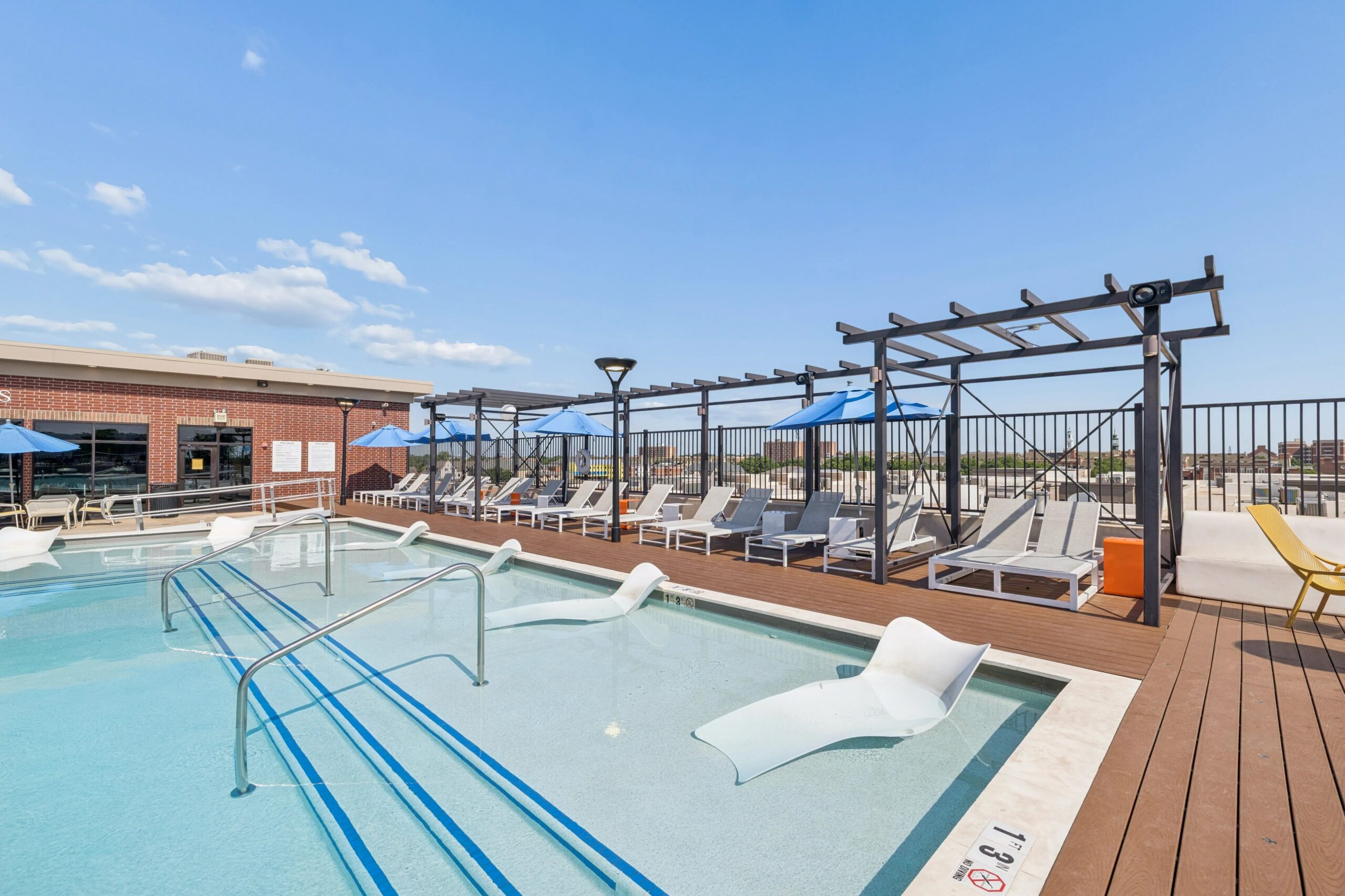 Rooftop Pool with Sun Loungers at Midtown Student Apartments in Stillwater, OK