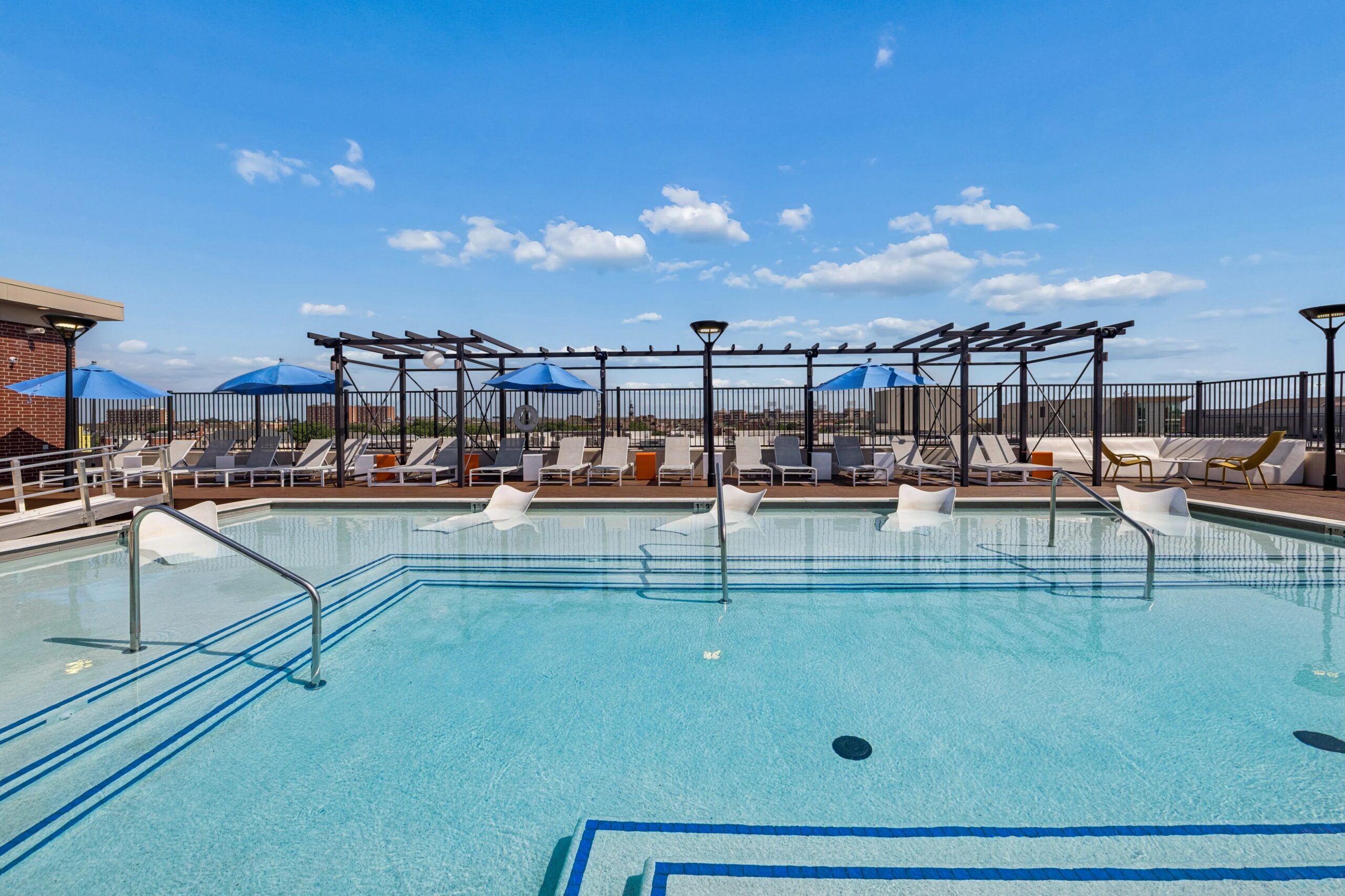 Pool with Lounge Chairs at Midtown Student Apartments in Stillwater, OK